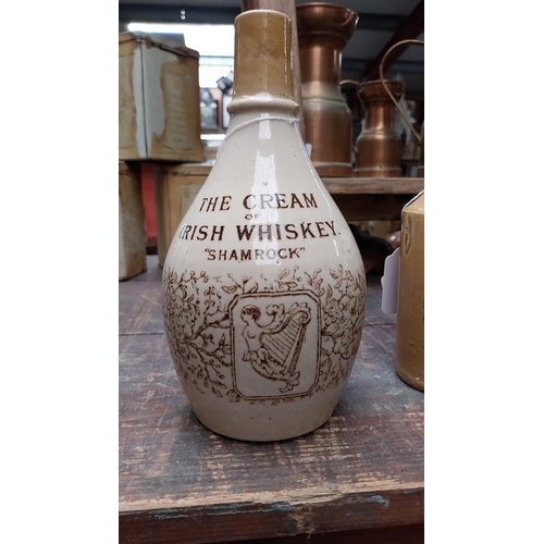 1052 - 19th C. The Cream of Irish Whiskey stoneware flagon. {22 cm H}.