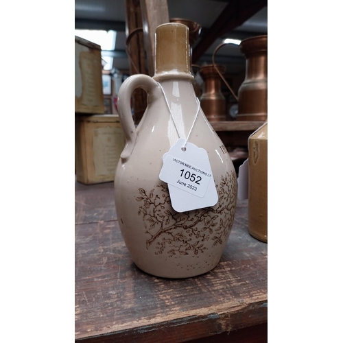 1052 - 19th C. The Cream of Irish Whiskey stoneware flagon. {22 cm H}.