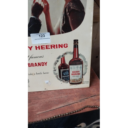 123 - Cherry Brandy celluloid advertising shelf sign {31 cm H x 21 cm W}.