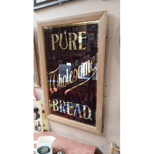 132 - Pure Wholesome Bread wood effect reverse painted glass framed advertising sign {88 cm H x 56 cm W}.