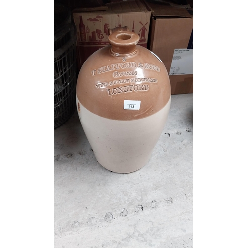 143 - T Stafford and Sons Grocers Longford stoneware flagon. {43 cm H X 25 cm Dia.}.