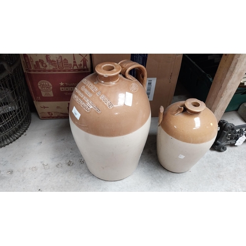 143 - T Stafford and Sons Grocers Longford stoneware flagon. {43 cm H X 25 cm Dia.}.