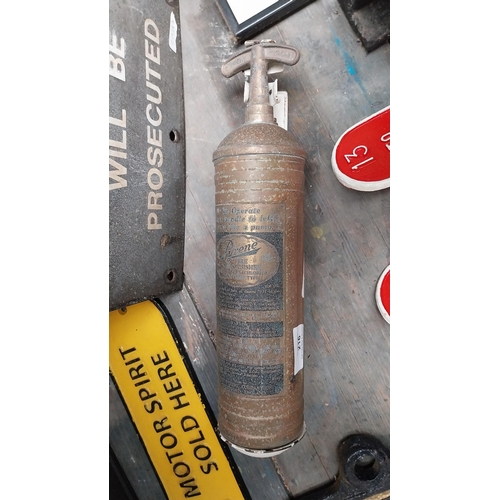 216 - Brass and metal Fire Extinguisher. {36 cm H x 9 cm W}.