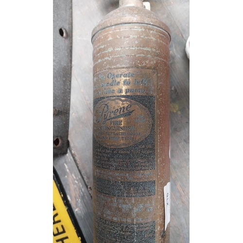 216 - Brass and metal Fire Extinguisher. {36 cm H x 9 cm W}.