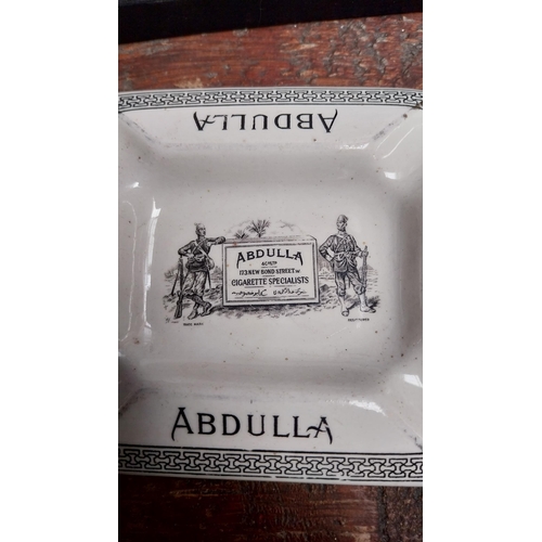 66 - Abdulla cigarettes ceramic ashtray. {12 cm H x 10 cm W}.