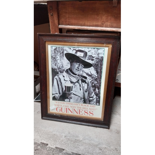 77 - Guinness John Wayne black and white framed print. {60 cm H x 49 cm W}.