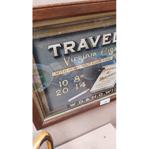 86 - Traveller Virginia Cigarettes framed advertising showcard. {31 cm H x 44 cm W}.