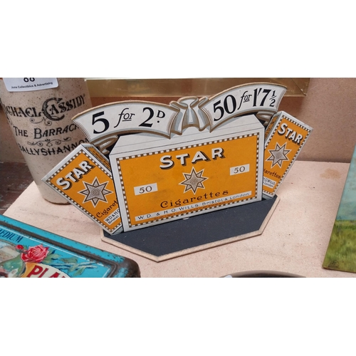 89 - Wills's Star die cut cardboard advertising showcard {13cm H x 23cm W}.