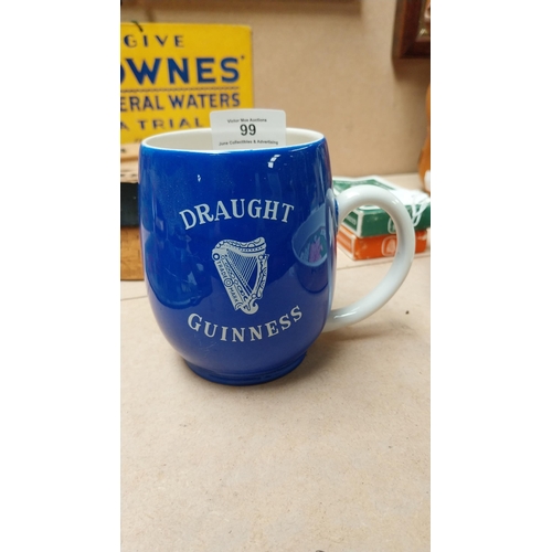 99 - Draught Guinness Carleton Ware blue ceramic advertising mug. {10cm H}.