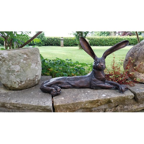 50. - Exceptional quality bronze sculpture of a Hare {36 cm H x 62 cm W x 30 cm D}.