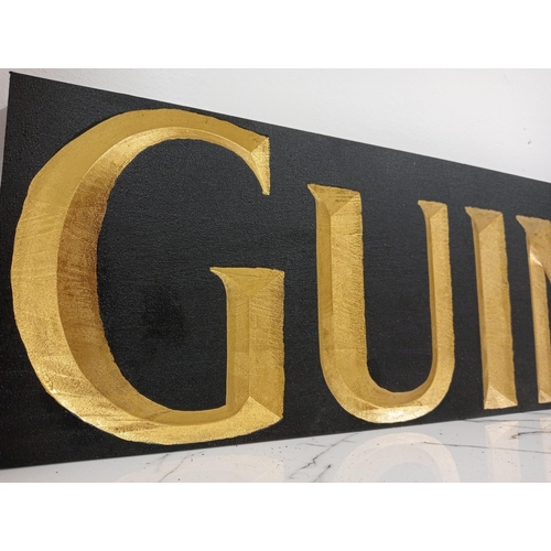 1261 - Guinness wooden advertising sign {H 20cm x W 100cm x D 3cm }.