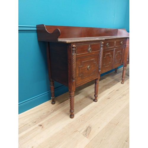 101 - 19th C. Irish mahogany side board with gallery back and three drawers in the frieze above four blind... 