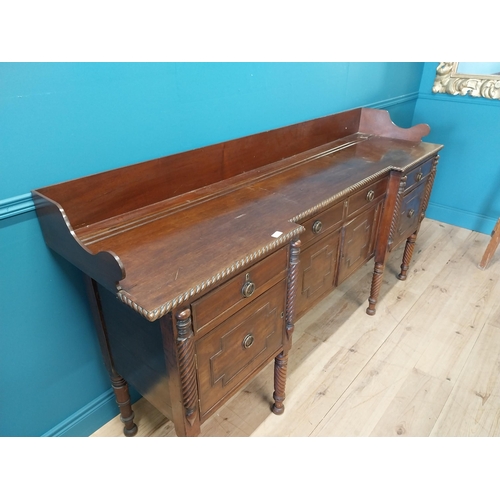 101 - 19th C. Irish mahogany side board with gallery back and three drawers in the frieze above four blind... 