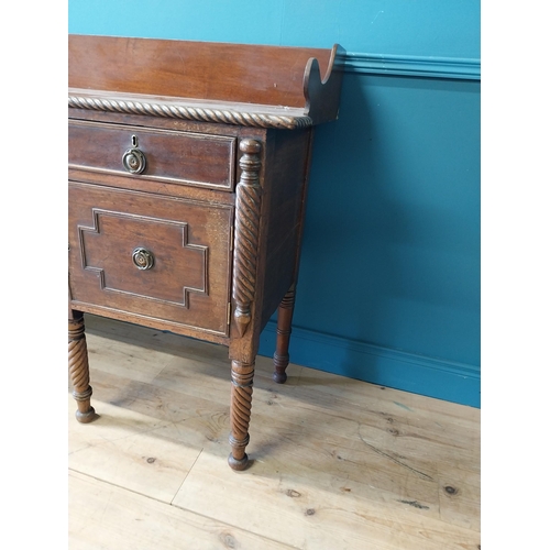 101 - 19th C. Irish mahogany side board with gallery back and three drawers in the frieze above four blind... 