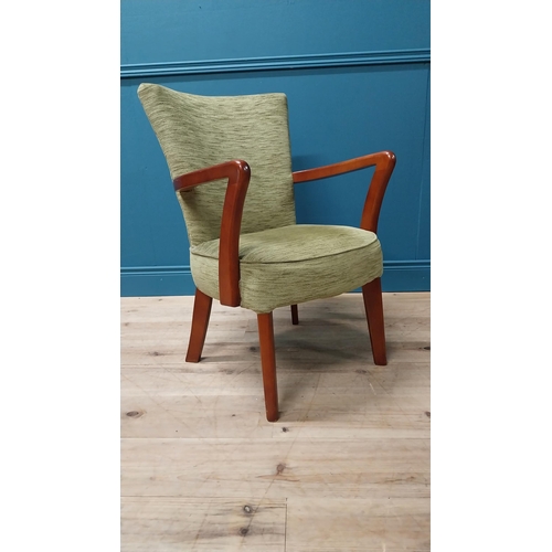 102 - 1950s mahogany and upholstered armchair raised on square tapered legs {84 cm H x 56 cm W x 50 cm D}.