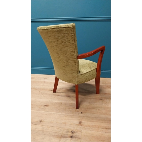 102 - 1950s mahogany and upholstered armchair raised on square tapered legs {84 cm H x 56 cm W x 50 cm D}.