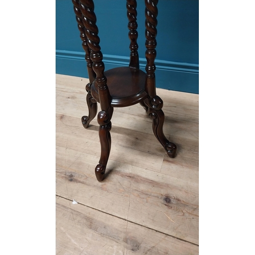 106 - Good quality mahogany jardini�re stand raised on barley twist columns and four outswept feet {78 cm ... 