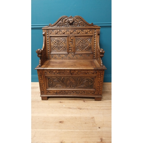 111 - Good quality Victorian carved oak monks bench decorated with lions masks {110 cm H x 91 cm W x 43 cm... 