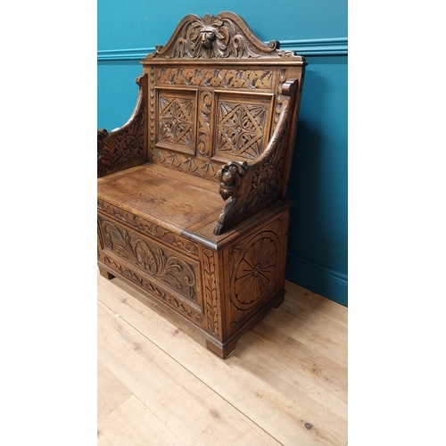 111 - Good quality Victorian carved oak monks bench decorated with lions masks {110 cm H x 91 cm W x 43 cm... 