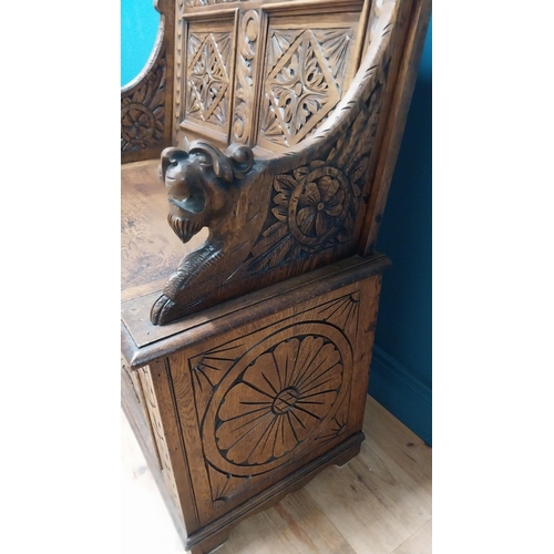 111 - Good quality Victorian carved oak monks bench decorated with lions masks {110 cm H x 91 cm W x 43 cm... 