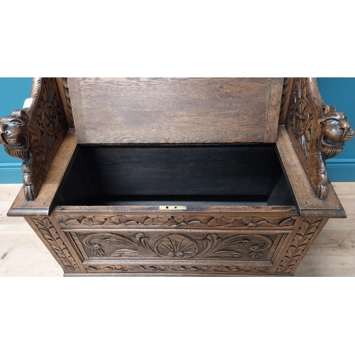 111 - Good quality Victorian carved oak monks bench decorated with lions masks {110 cm H x 91 cm W x 43 cm... 