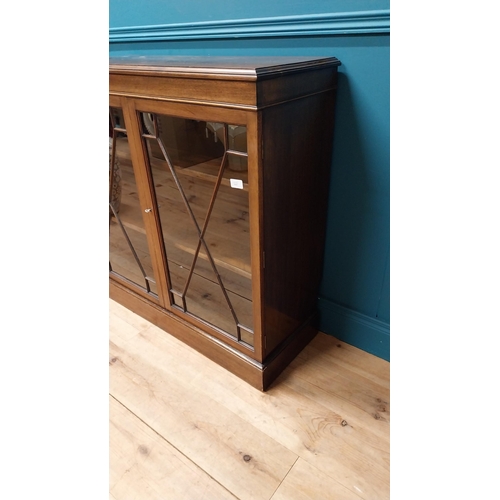 112 - Good quality Edwardian mahogany bookcase with two astral glazed doors raised on platform base {92 cm... 