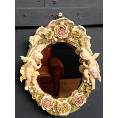 113 - Capodimonte oval wall mirror {H 45cm x W 31cm }.