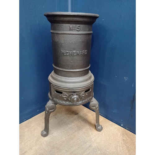 119 - Cast iron three legged stove {H 58cm x W 34cm x D 34cm}.