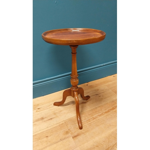 122 - 1950s mahogany wine table raised on turned column and three outswept feet {51 cm H x 30 cm Dia.}.