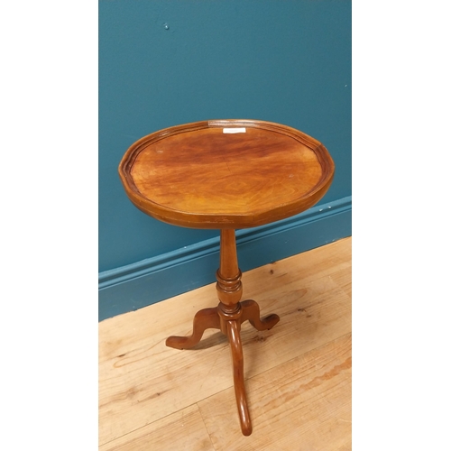 122 - 1950s mahogany wine table raised on turned column and three outswept feet {51 cm H x 30 cm Dia.}.