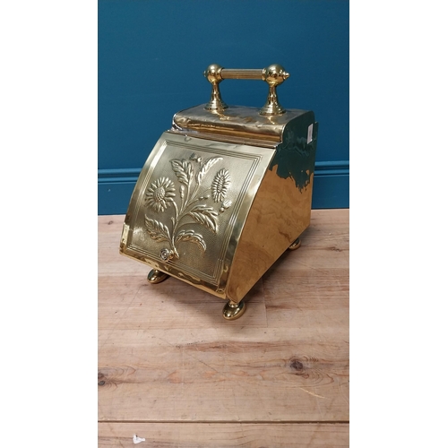 125 - Edwardian embossed brass coal scuttle with original metal liner {44 cm H x 26 cm W x 40 cm D}.