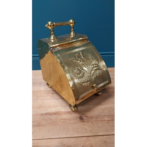 125 - Edwardian embossed brass coal scuttle with original metal liner {44 cm H x 26 cm W x 40 cm D}.