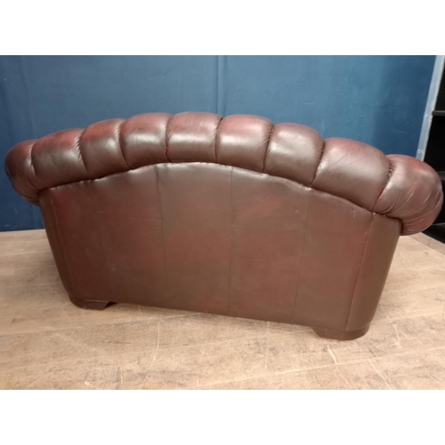 133 - Brown leather deep buttoned two seater sofa  {H 80cm x W 160cm x D 80cm }.