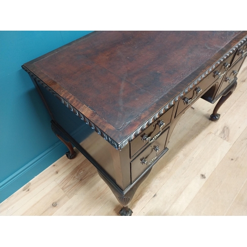 137 - Edwardian mahogany desk with inset leather top and brass handles raised on cabriole legs and ball an... 