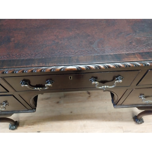 137 - Edwardian mahogany desk with inset leather top and brass handles raised on cabriole legs and ball an... 