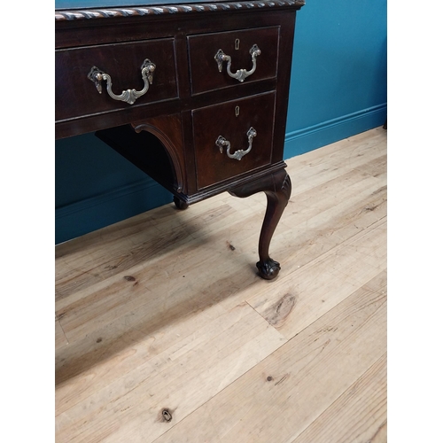 137 - Edwardian mahogany desk with inset leather top and brass handles raised on cabriole legs and ball an... 