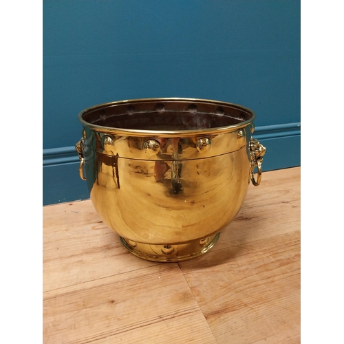 176 - Good quality Victorian brass jardini�re with lions mask handles {26 cm H x 36 cm Dia.}.