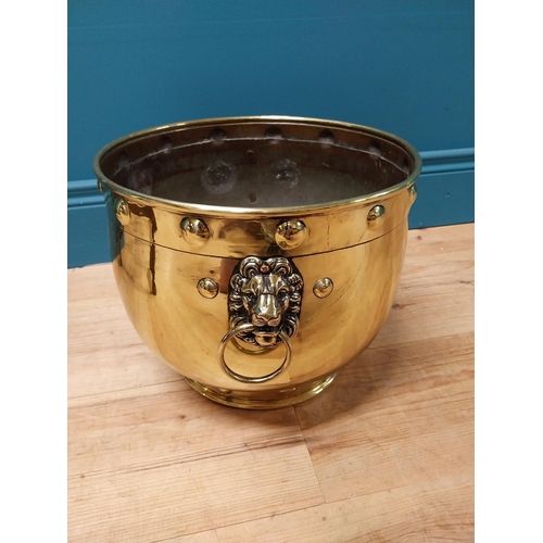 176 - Good quality Victorian brass jardini�re with lions mask handles {26 cm H x 36 cm Dia.}.