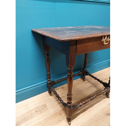 181 - 19th C. oak side table with single drawer raised on turned legs {72 cm H x 73 cm W x 52 cm D}.