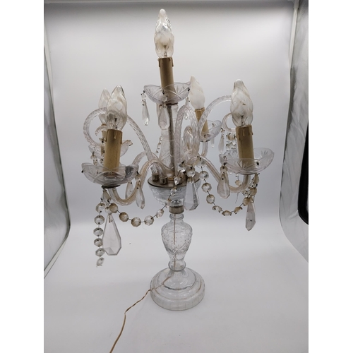 182 - 20th C. Moulded glass four branch table candelabra with some damage. {68 cm H x 42 cm Dia.}