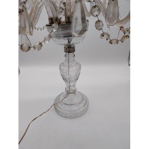 182 - 20th C. Moulded glass four branch table candelabra with some damage. {68 cm H x 42 cm Dia.}