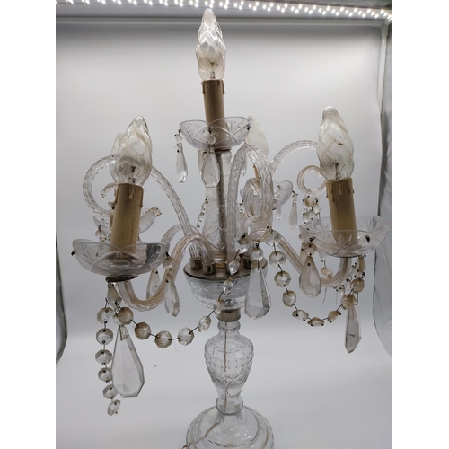 182 - 20th C. Moulded glass four branch table candelabra with some damage. {68 cm H x 42 cm Dia.}