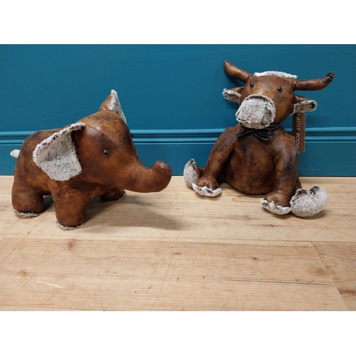 191 - Two leather door stops in the form of Cow and Elephant {36 cm H x 38 cm W x 20 cm D and 27 cm H x 47... 