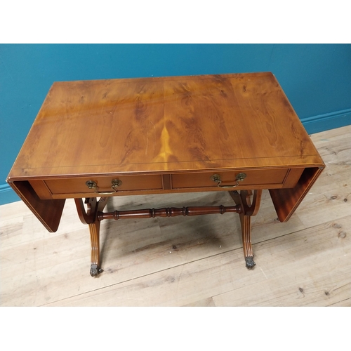 192 - Good quality yew wood library table with two drawers in the frieze raised on lyre supports and brass... 