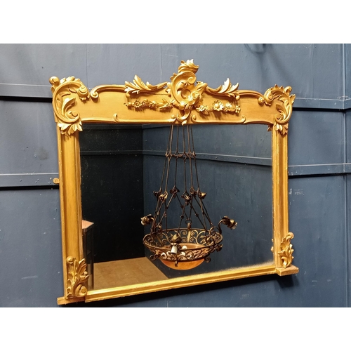 193 - Decorative gilt overmantle mirror {H 108cm x W 122cm }.