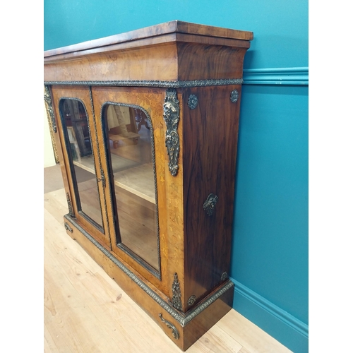 197 - Good quality 19th C. French burr walnut and inlaid side cabinet with ormolu mounts and two glazed do... 