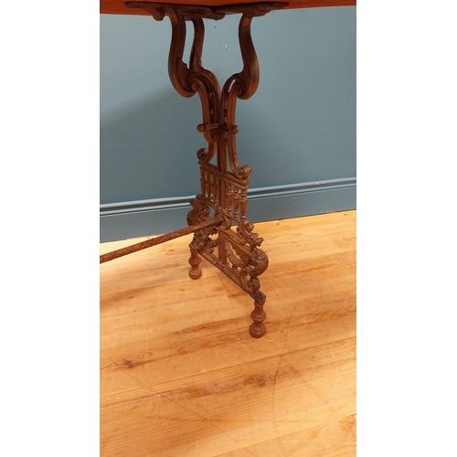 21 - 19th C. decorative cast iron table with ebonised top {73 cm H x 121 cm W x 54 cm D}.