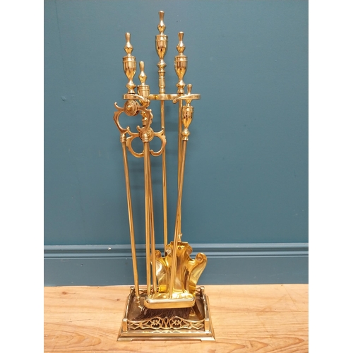 214 - Victorian brass companion set {77 cm H x 25 cm W x 17 cm D}.