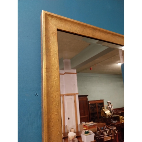 215 - Gilt wall mirror {110 cm H x 69 cm W}.