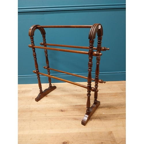 220 - Edwardian oak towel rail raised on turned column and platform feet {82 cm H x 80 cm W x 34 cm D}.